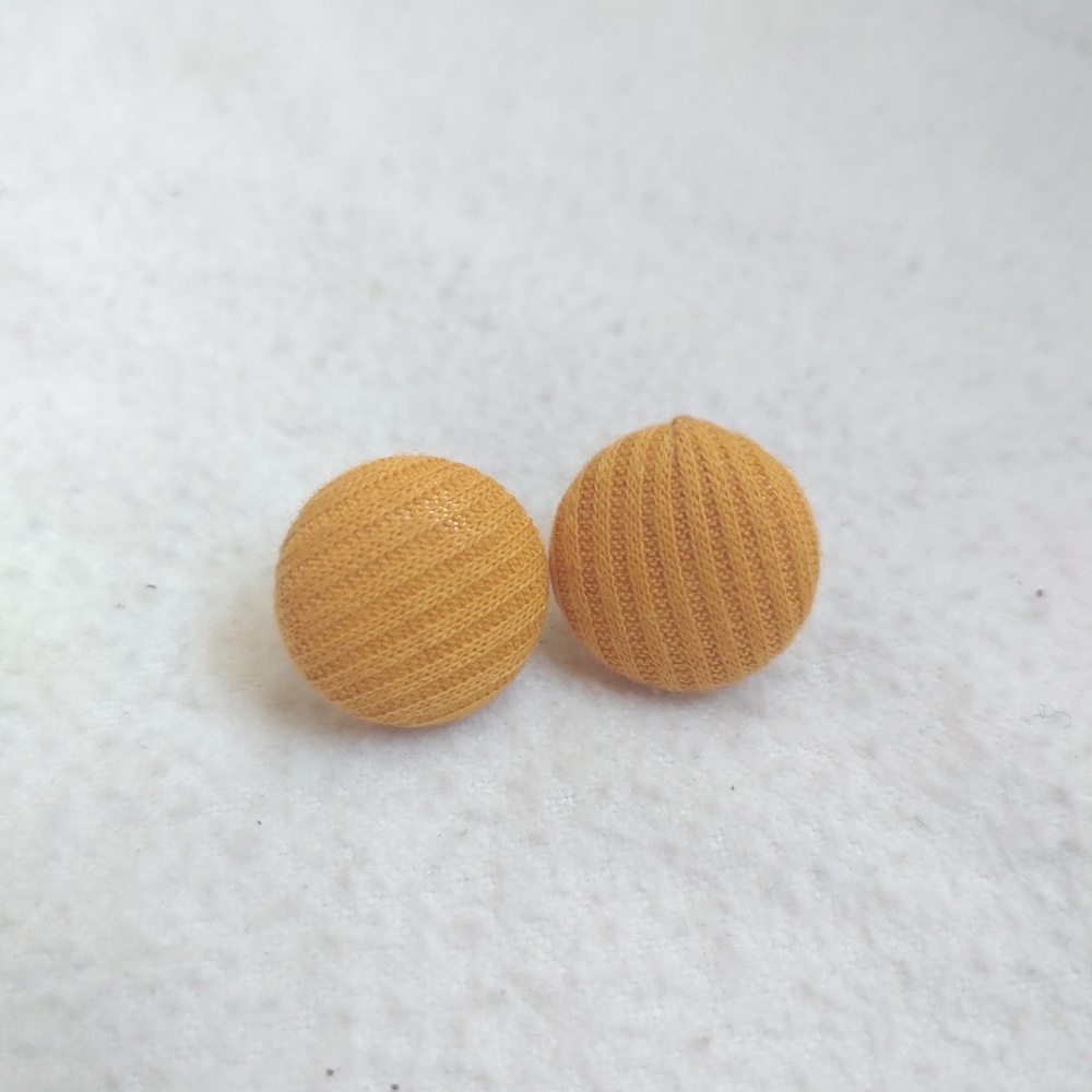 Mustard yellow button stud earrings.